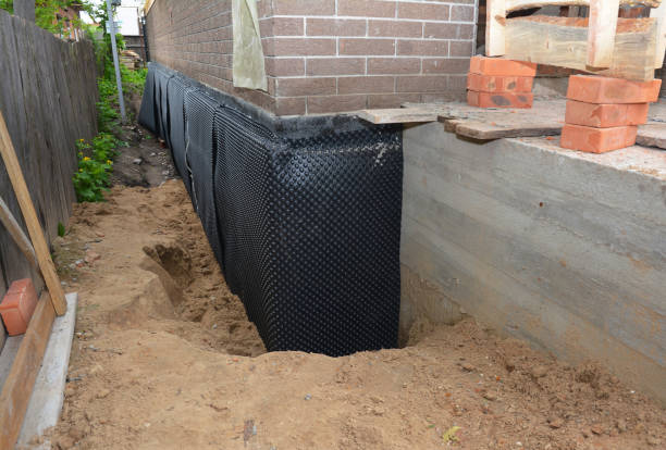 Happy homeowners after waterproofing job in Pikesville